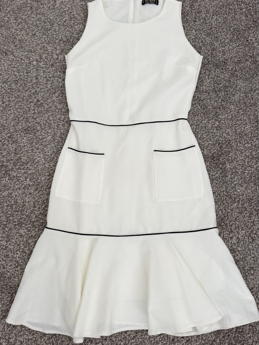 Sleeveless White Fit-and-Flare Dress with Black Piping
